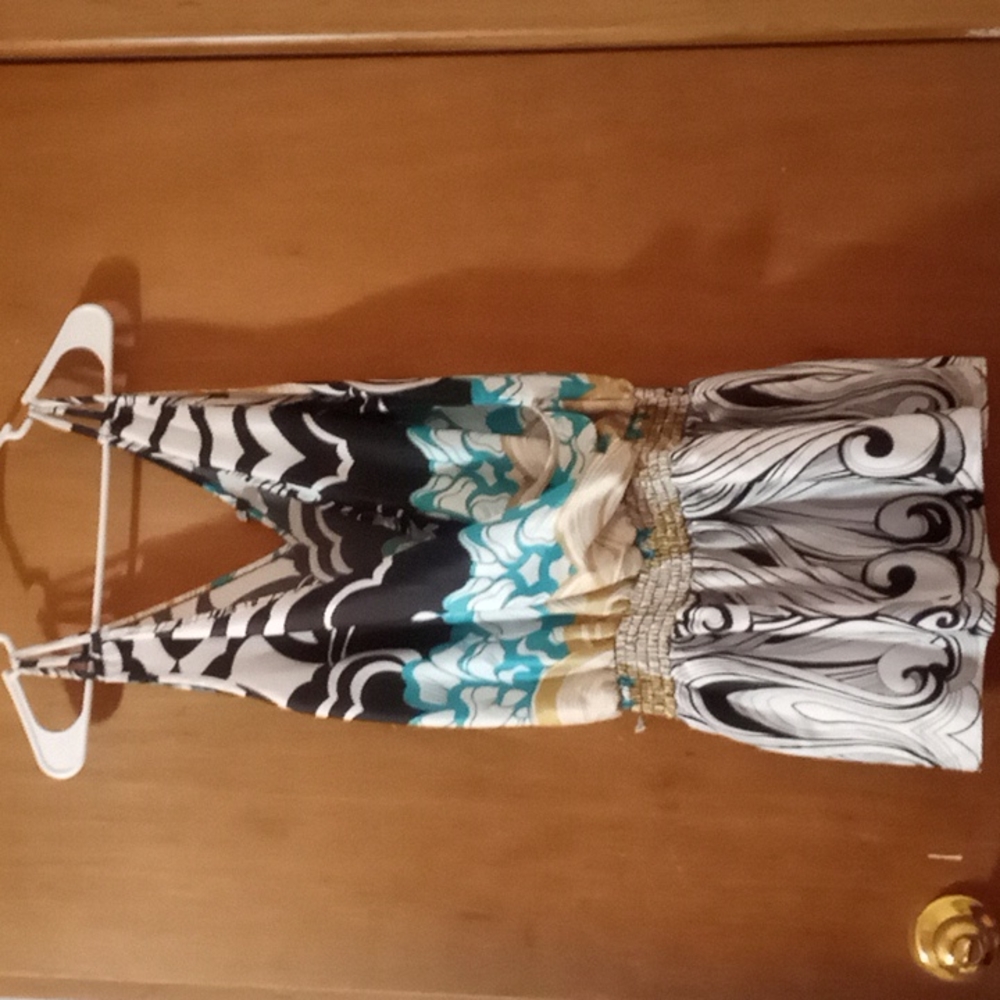 This is a short fun light dress 95% polyester 5% spandex and it says medium